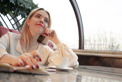 Young woman with coffee