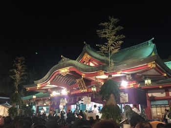 Crowd on illuminated city at night