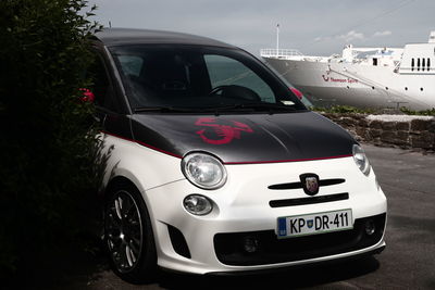 Close-up of car against sky