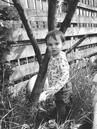 Portrait of girl playing on grass