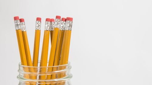 Close-up of pencils against white background