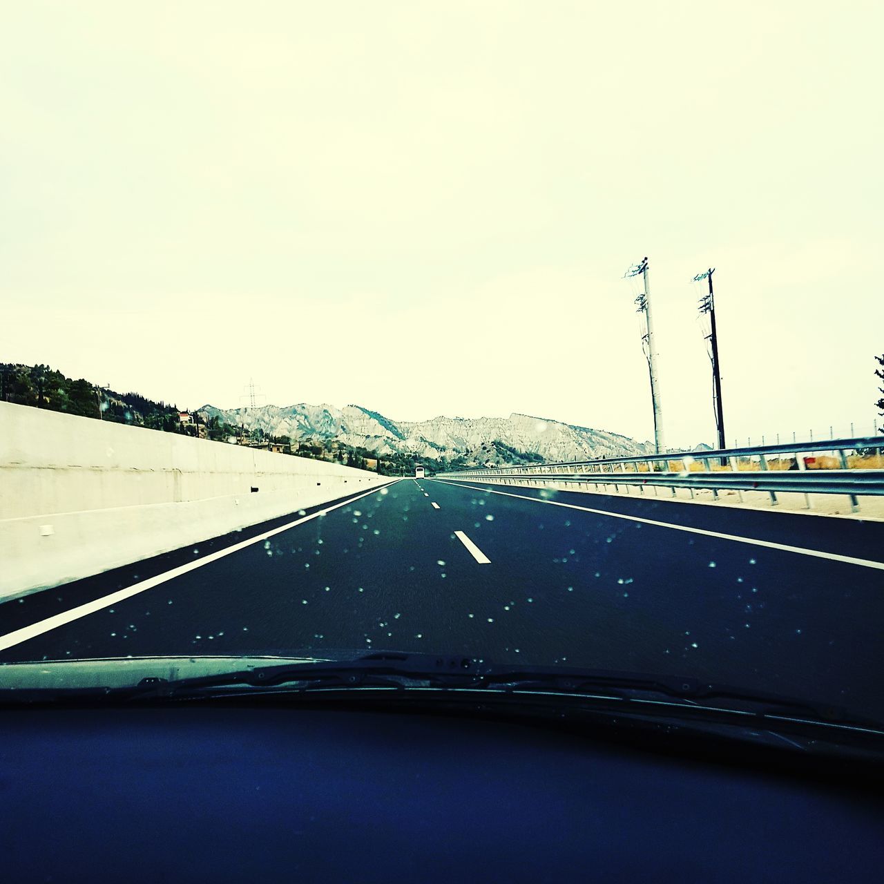 transportation, car, windshield, vehicle interior, land vehicle, mode of transport, car interior, road, car point of view, no people, copy space, dashboard, day, the way forward, road trip, nature, sky, clear sky, outdoors, mountain, close-up