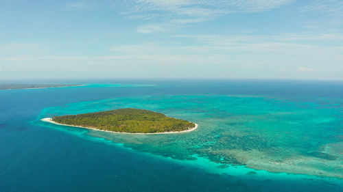 Tropical islands with white beaches and atolls and coral reef, aerial view. 