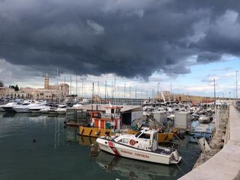 Boats moored at harbor