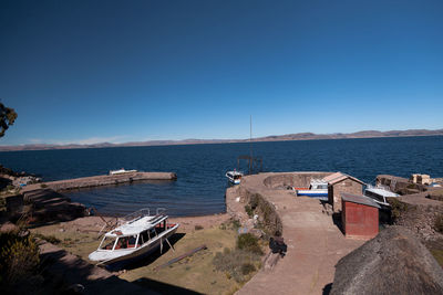 Panoramic view of beach against clear blue sky