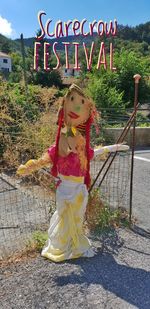 Full length of girl standing by plants