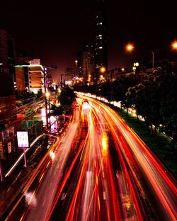 High angle view of light trails on road at night