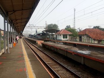 Railroad station platform against sky