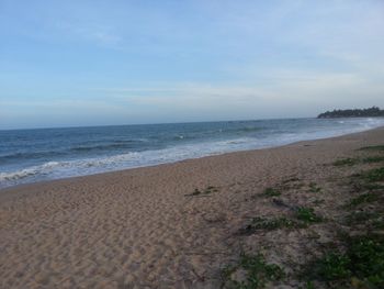 Scenic view of beach against sky