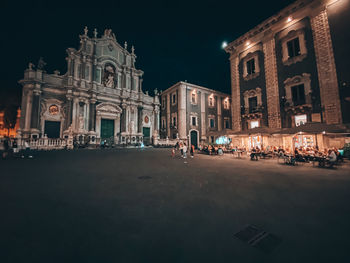 Buildings in city at night