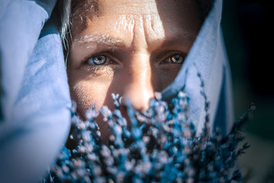 Close-up portrait of woman wearing scarf