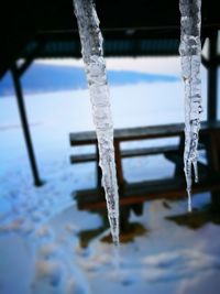 Close-up of frozen ice against sky