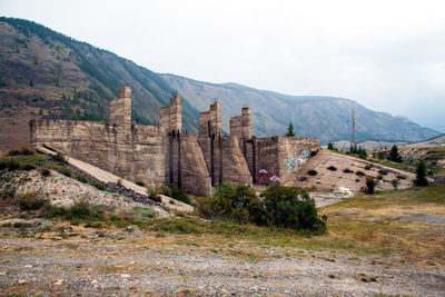 View of castle on mountain against sky