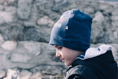 Boy standing outdoors