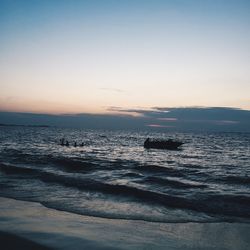 Scenic view of calm sea at sunset