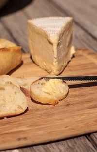 Close-up of bread with cheese on wooden table