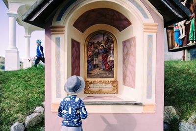 Woman standing against wall