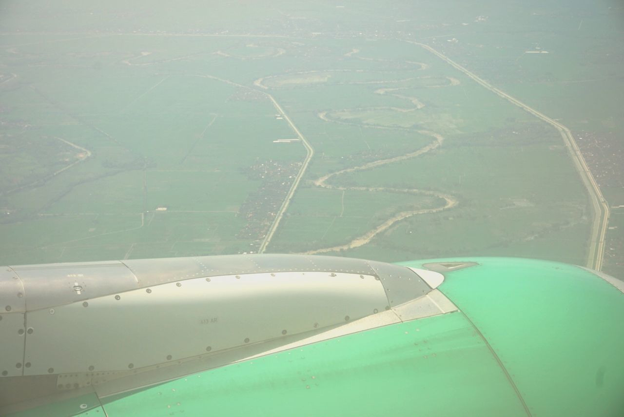 air vehicle, airplane, transportation, mode of transportation, flying, landscape, aerial view, environment, day, travel, nature, no people, land, outdoors, jet engine, green color, beauty in nature, water, scenics - nature, engine, plane