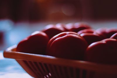 Close-up of fruits in basket on table