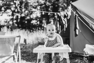 Portrait of woman sitting on chair