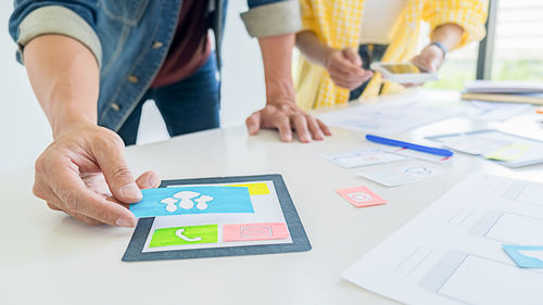 Cropped image of business colleagues working in office