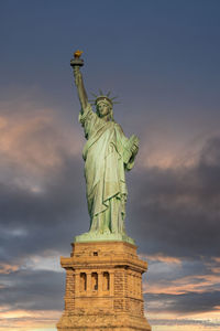 Low angle view of statue against sky during sunset