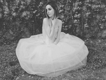 Portrait of a beautiful young woman on field