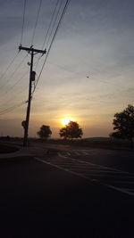 Scenic view of road against sky during sunset