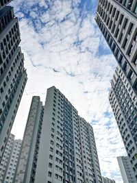 Low angle view of buildings in city against sky