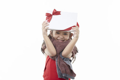 Portrait of a girl wearing hat against white background