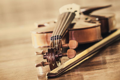 Close-up of guitar on table