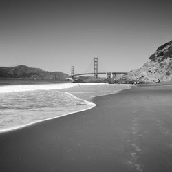 View of suspension bridge over sea
