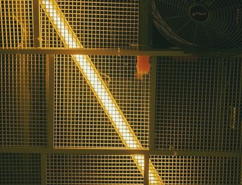 Full frame shot of illuminated metal grate