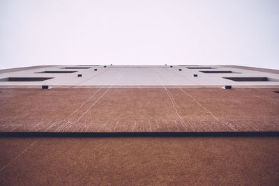 Directly below view of building against sky