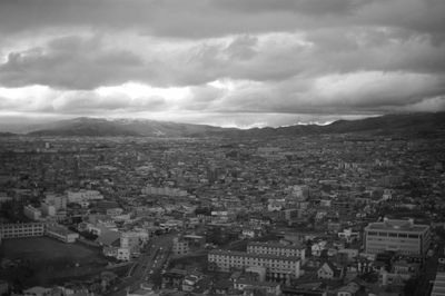 Aerial view of cityscape against sky