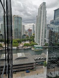 Modern buildings in city against sky