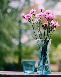 Close-up of pink flower vase on table