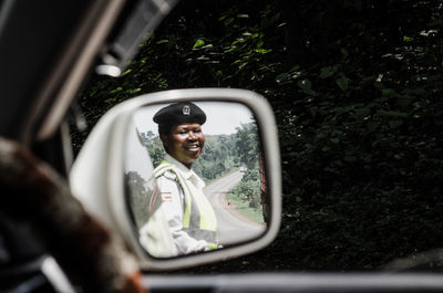 Portrait of smiling young woman in car