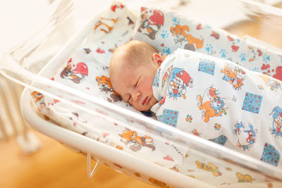 High angle view of cute baby sleeping