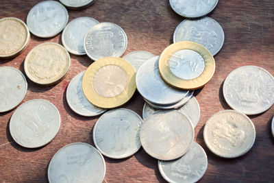 High angle view of coins on table