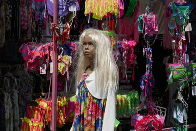 Doll hanging at market stall