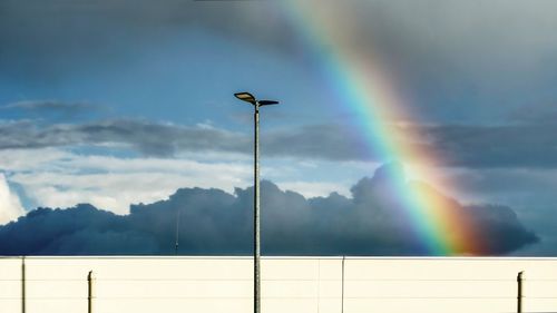 Low angle view of rainbow against sky