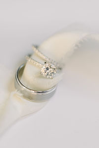 Close-up of wedding rings against white background