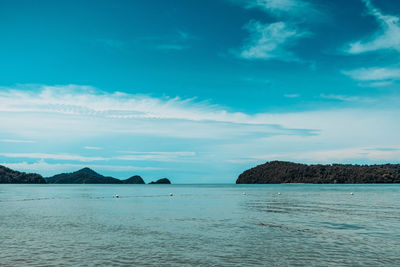 Scenic view of sea against blue sky