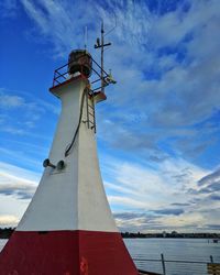 Low angle view of windmill against sky