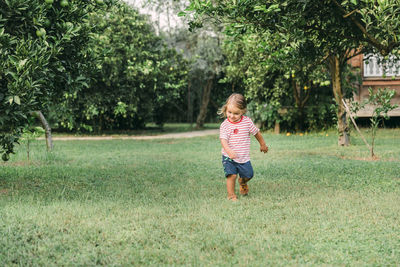 Cute girl running on grass