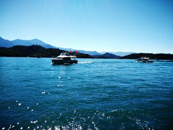 Scenic view of sea against clear blue sky