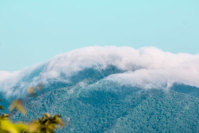 Aerial view of clouds over mountain