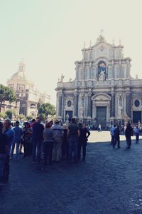 Tourists in front of building