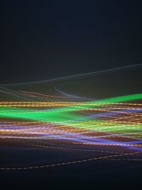 Light trails on road in city at night